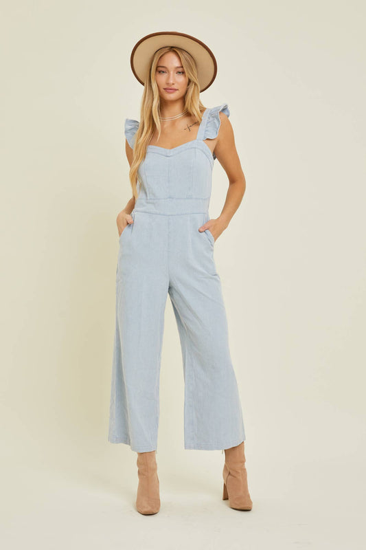 DENIM JUMPSUIT WITH RUFFLE SHOULDER STRAP