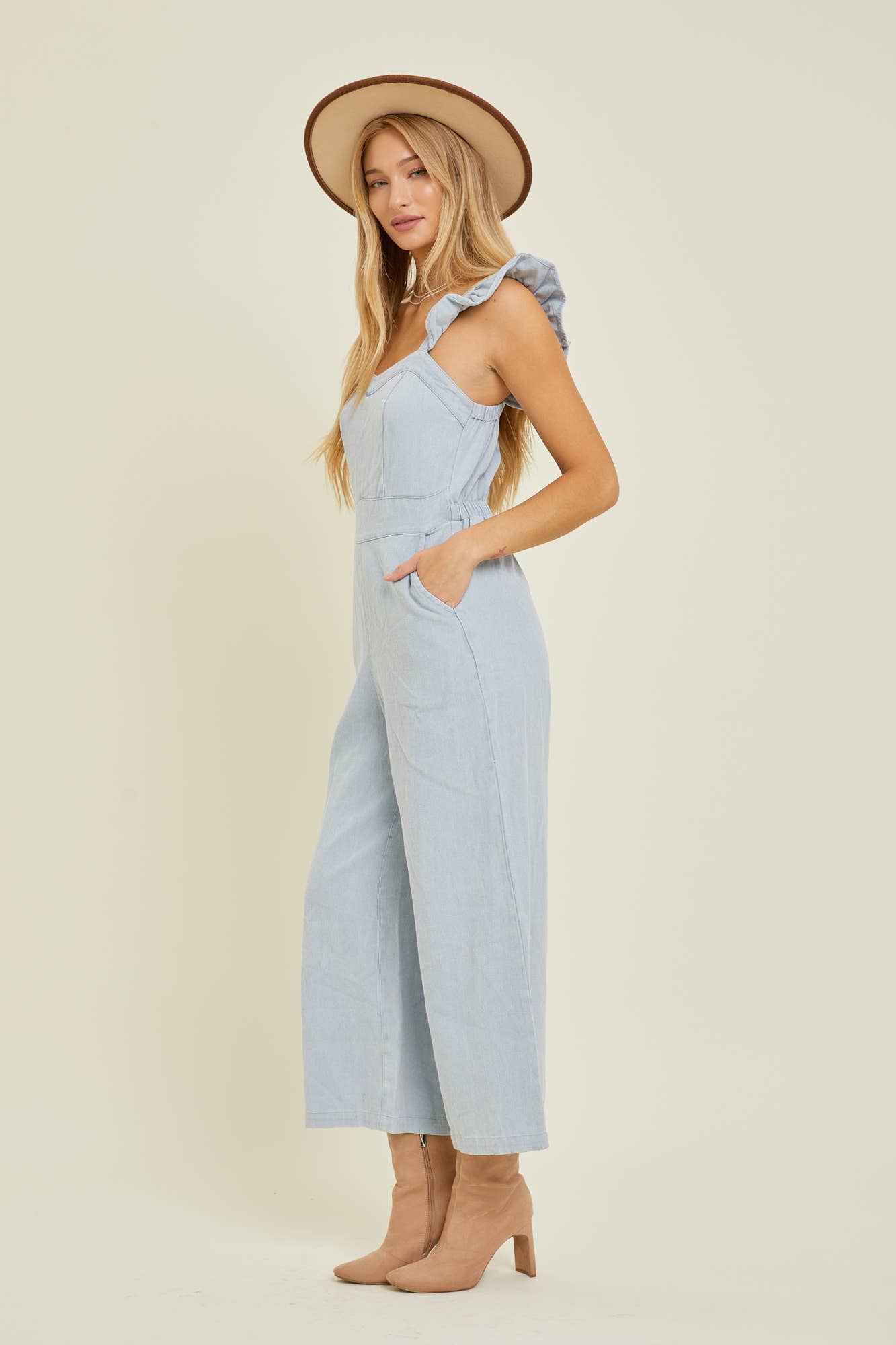 DENIM JUMPSUIT WITH RUFFLE SHOULDER STRAP