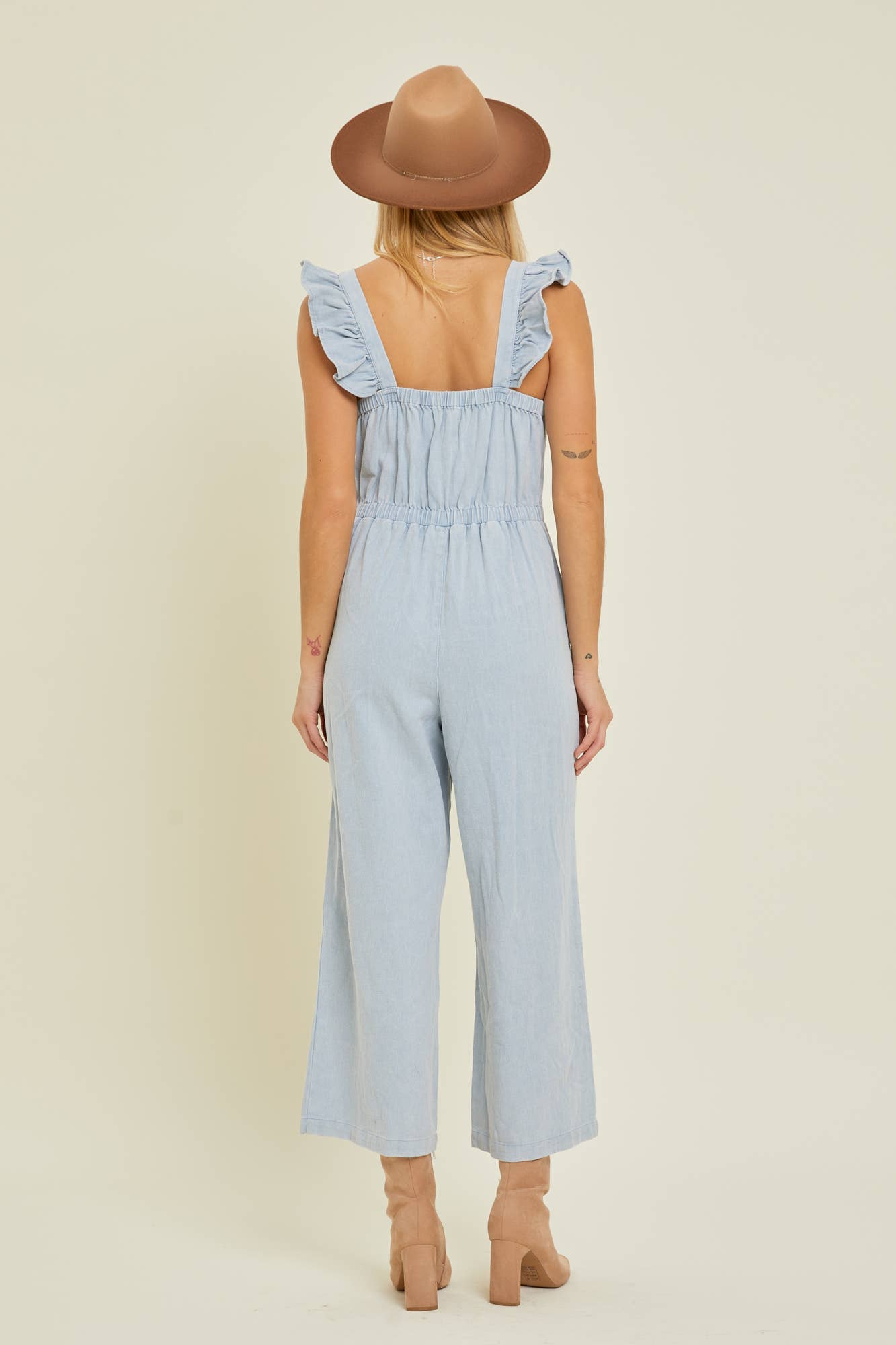 DENIM JUMPSUIT WITH RUFFLE SHOULDER STRAP